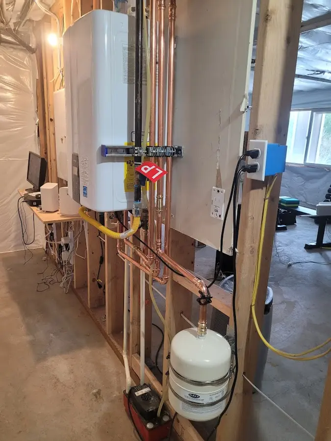 Licensed plumber repairing a kitchen sink in Montville